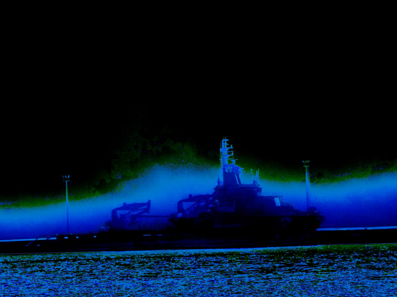 A ship silhouetted at a dock, shrouded in radiant blue mist, water shimmering below, all under a near-black sky.